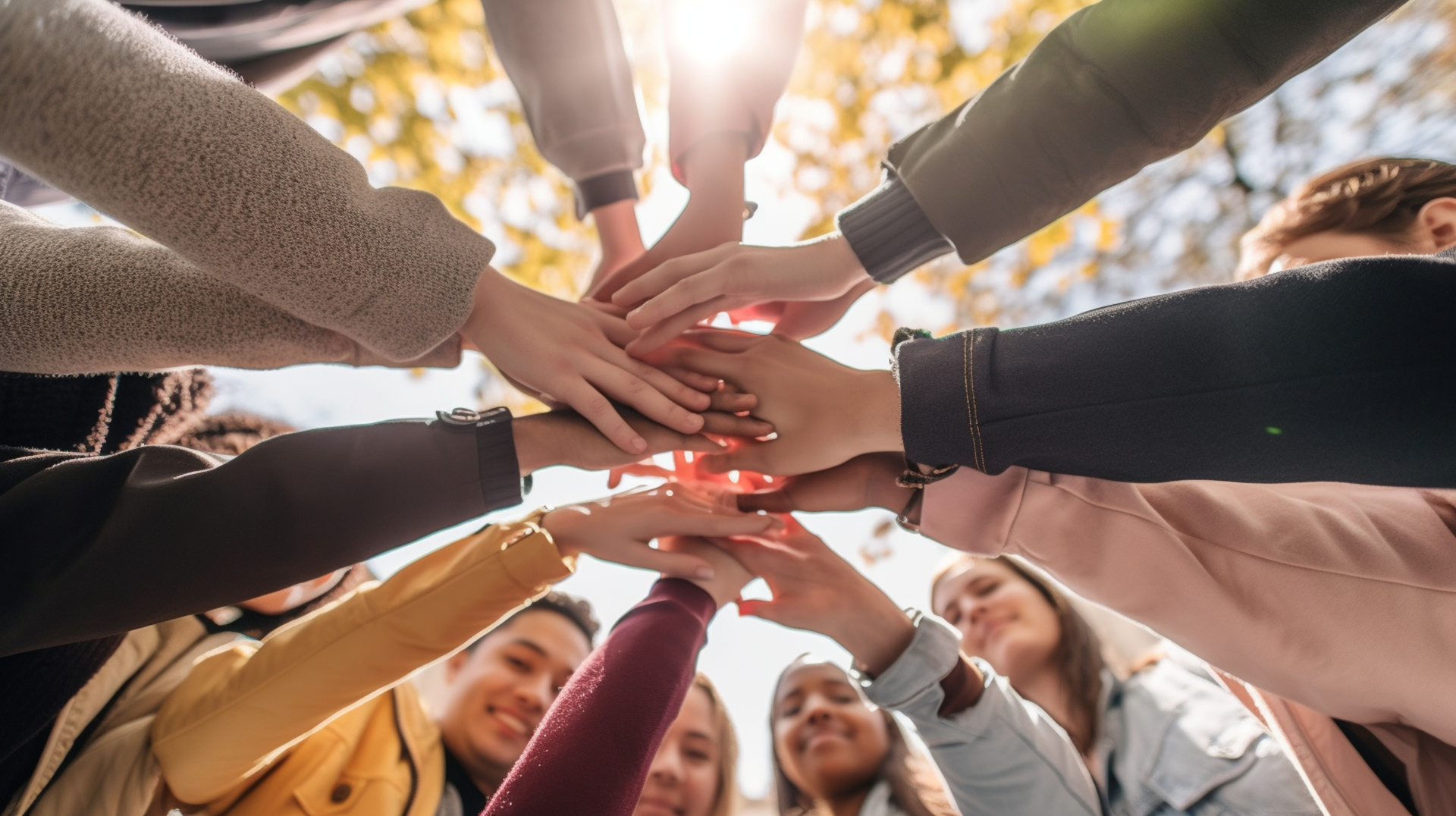 A gathering of young adults clasping their hands in unity - Diverse group of university students joining hands in a stack - The notion of human connection, societal bonds, communal Generative AI A gathering of young adults clasping their hands in unity - Diverse group of university students joining hands in a stack - The notion of human connection, societal bonds, communal Generative AI