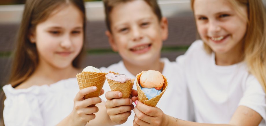 Happy children sitting together close and smile Happy children sitting together close and smile