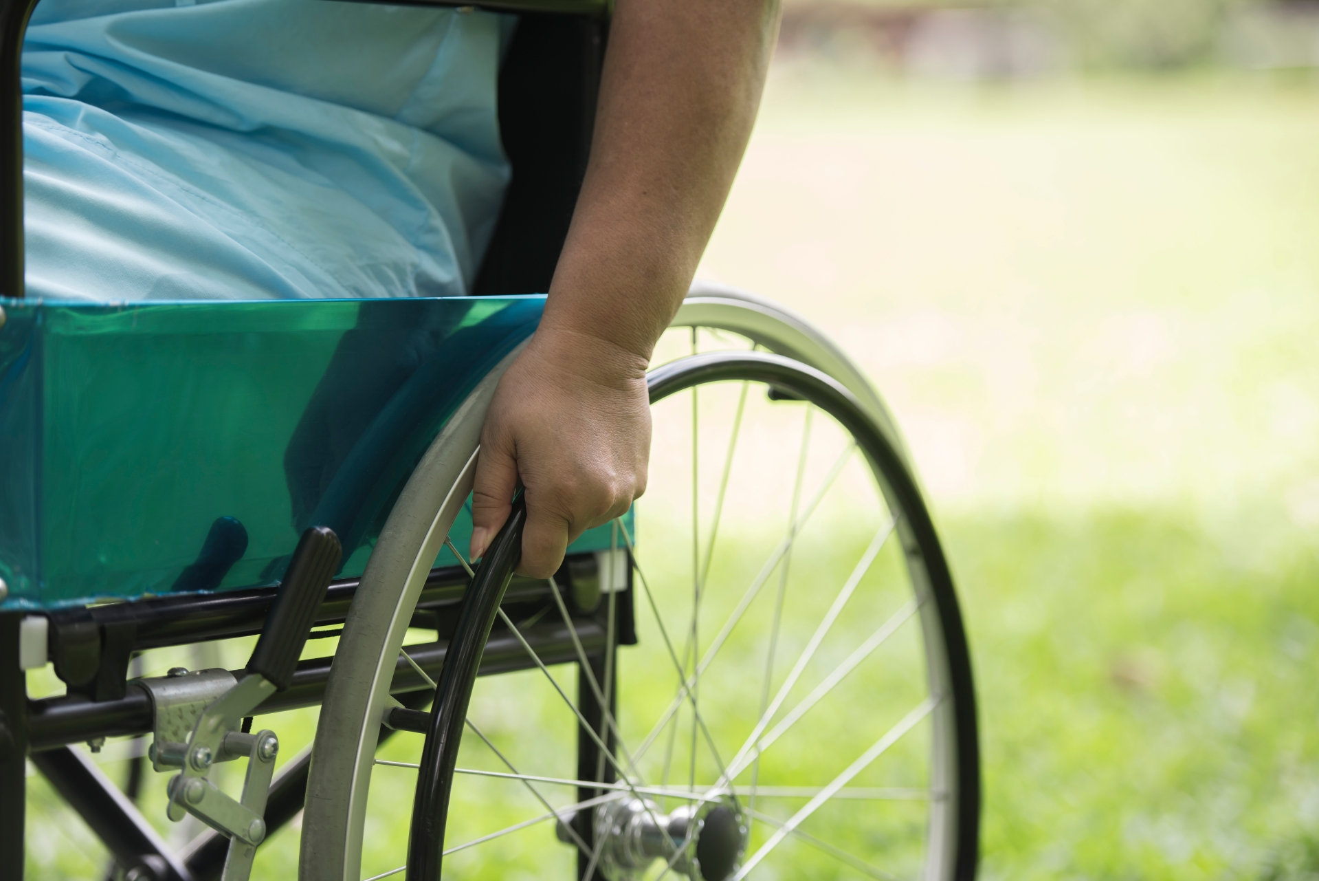 Close up Lonely elderly woman sitting on wheelchair at garden in hospital Close up Lonely elderly woman sitting on wheelchair at garden in hospital