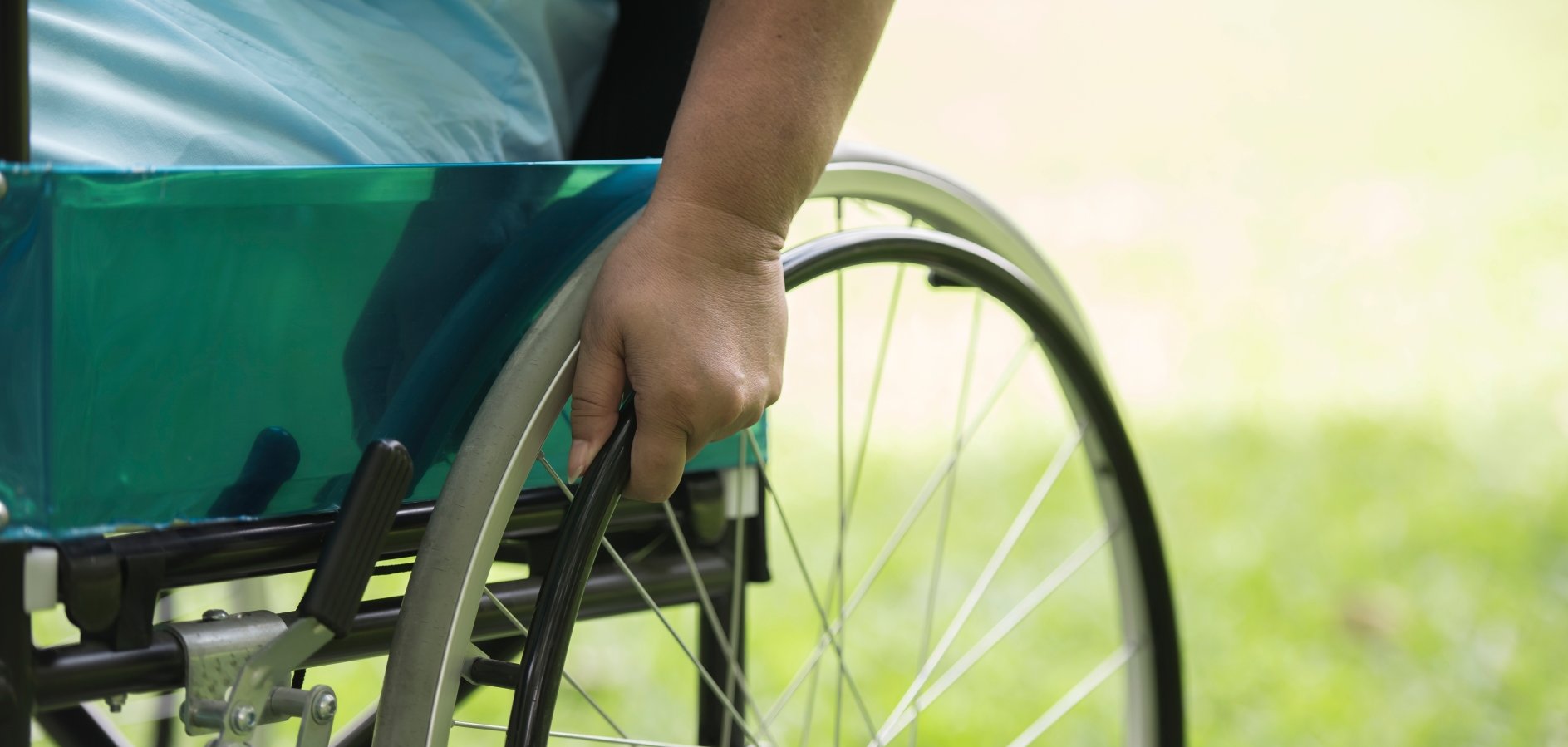 Close up Lonely elderly woman sitting on wheelchair at garden in hospital